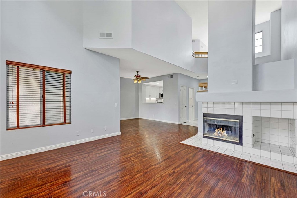 Spacious Living Room with Fireplace and High Ceilings in Real Estate Listing