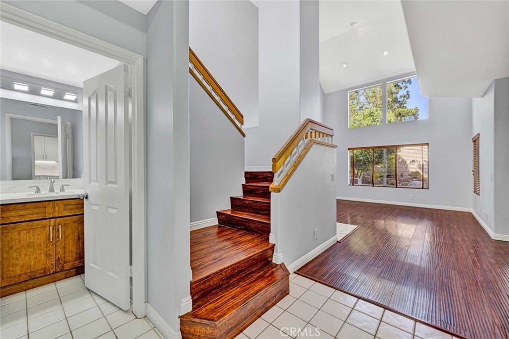 Spacious Modern Interior with Wooden Staircase and Bright Living Area