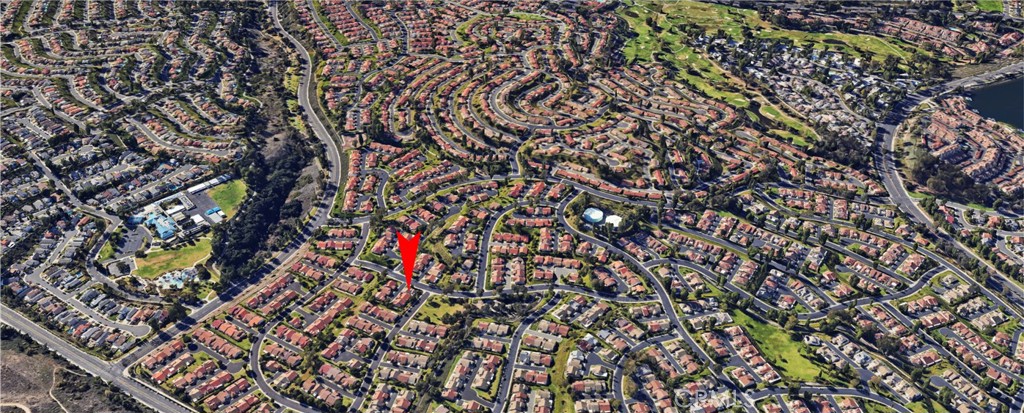 Aerial View of Suburban Neighborhood with Red Arrow Highlighting Homes for Sale