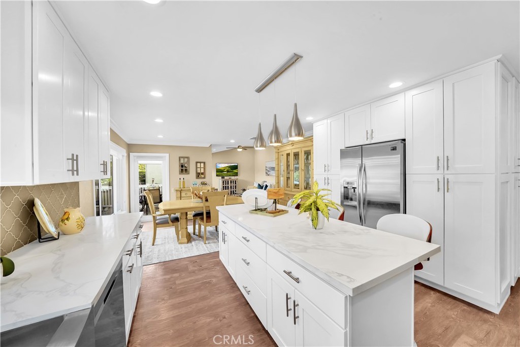 Modern Kitchen with White Cabinets and Marble Countertops in Real Estate Listing