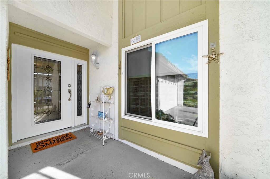 Front Porch with Decor and Doormat, Reflecting Spacious Real Estate Listings