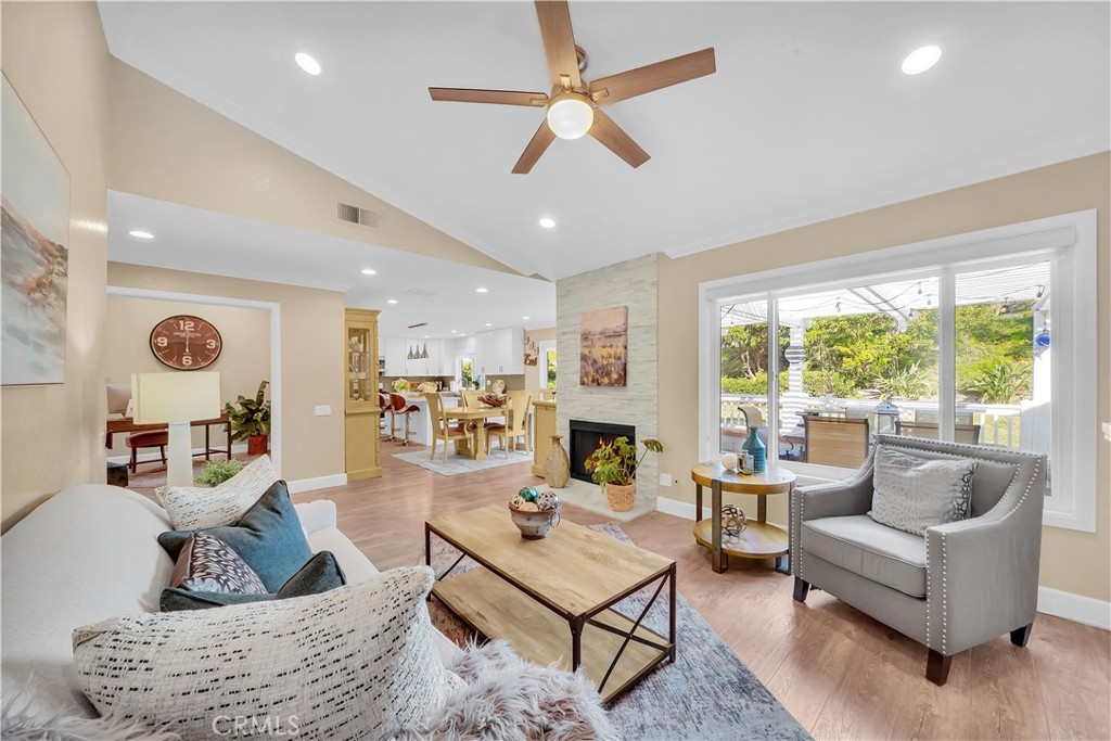 Spacious Living Room with Modern Furniture and Large Windows in Real Estate Listing