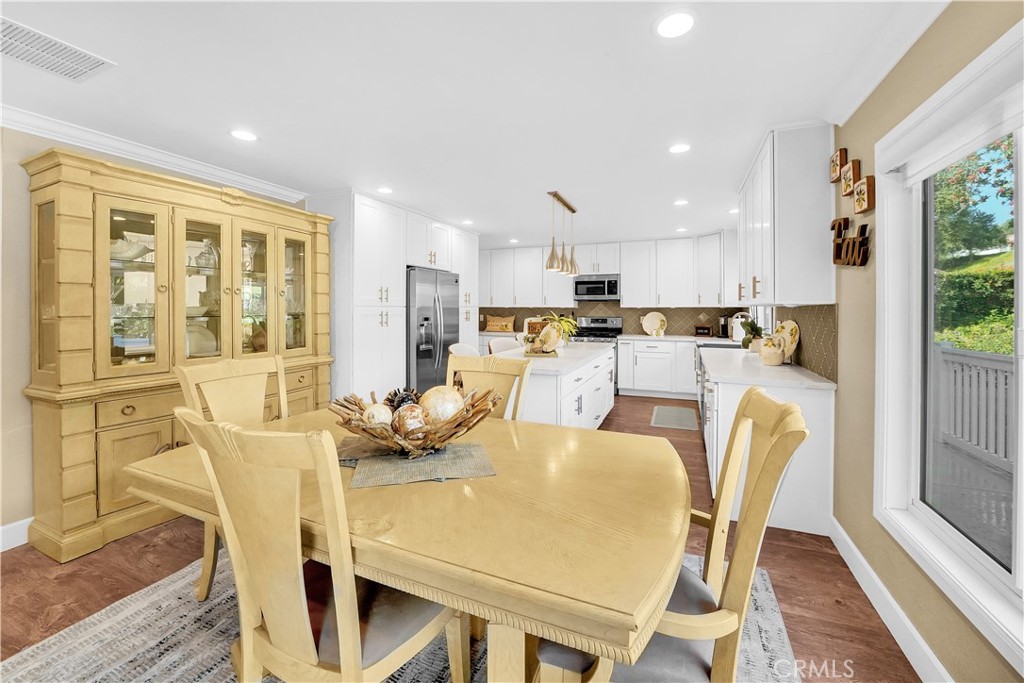 Bright Modern Kitchen and Dining Area with Wooden Furniture and Real Estate Appeal