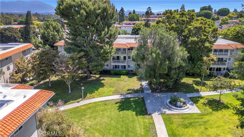 Tree-Lined Residential Complex with Grass Courtyard and Pathways