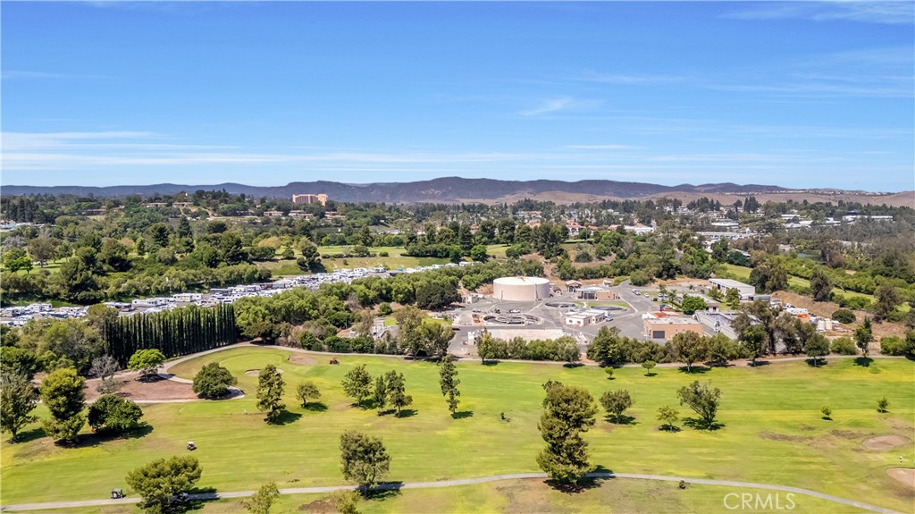 Scenic View of Golf Course and Surrounding Real Estate Listings