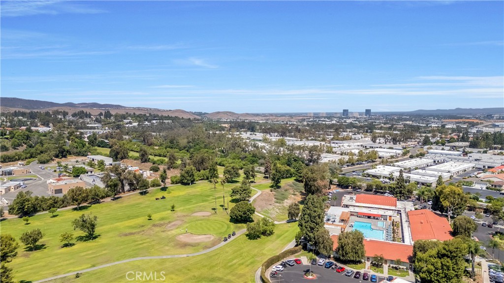 Aerial View of Golf Course and Surrounding Real Estate Listings