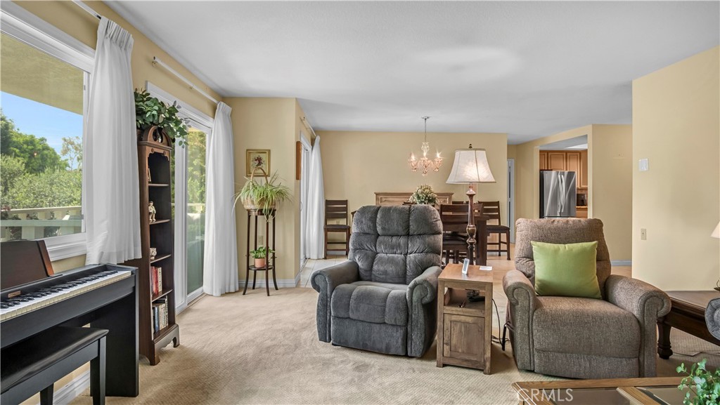Spacious Living Room with Comfortable Seating and Natural Light