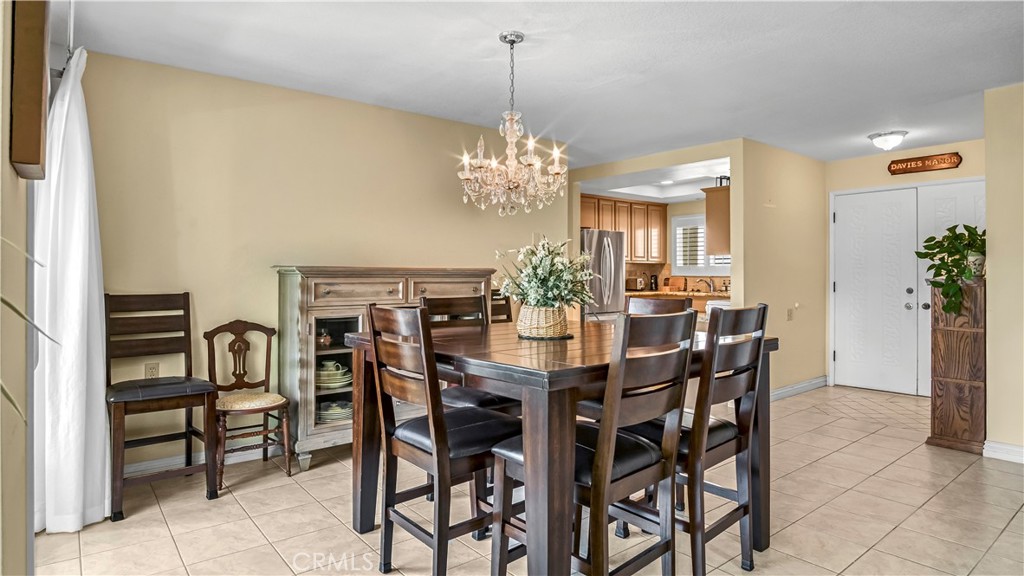 Dining Room with Wood Furniture and Elegant Chandelier, Homes for Sale