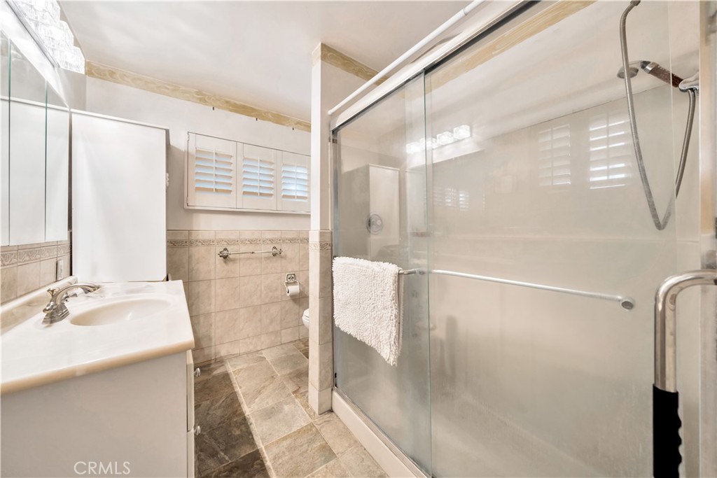Bathroom with glass-enclosed shower and modern fixtures