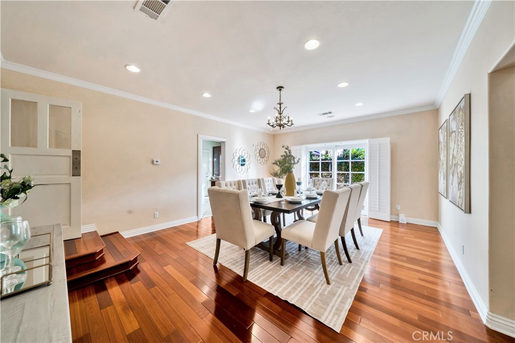 Bright Dining Room with Wooden Floor and Elegant Furniture in Homes for Sale