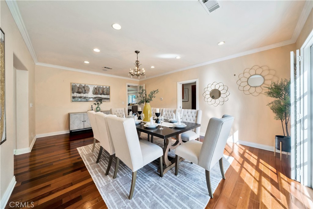 Elegant Dining Room with Hardwood Floors and Modern Decor Real Estate