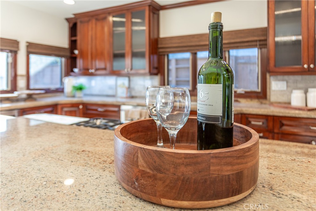 Kitchen Interior with Wine Bottle and Glasses on Granite Countertop