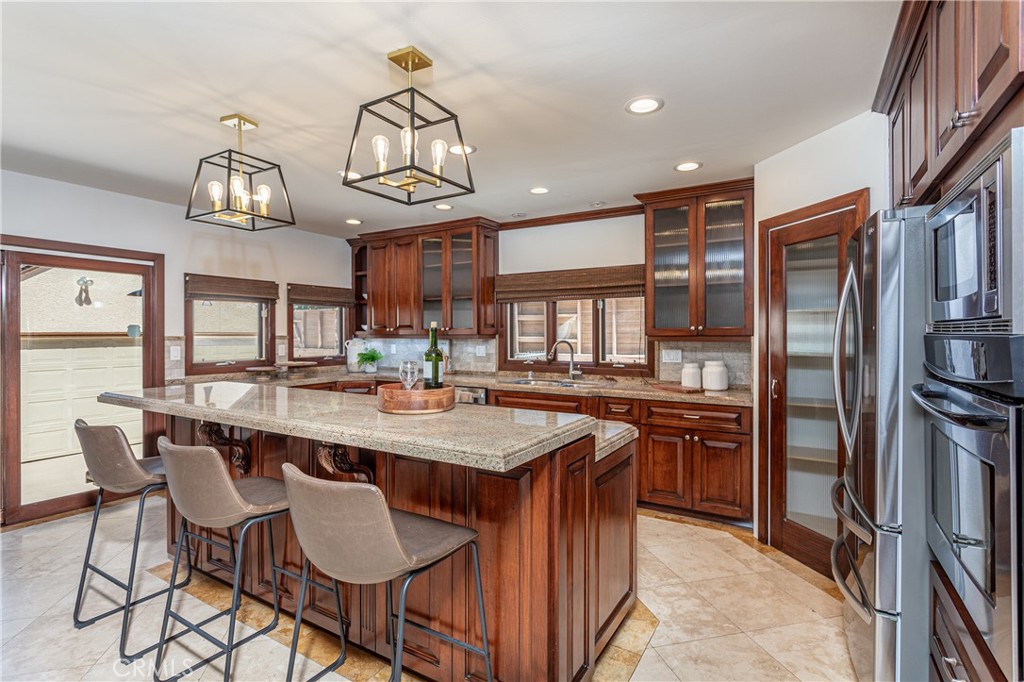 Modern Kitchen with Wooden Cabinets and Granite Island, Perfect for Real Estate Listings