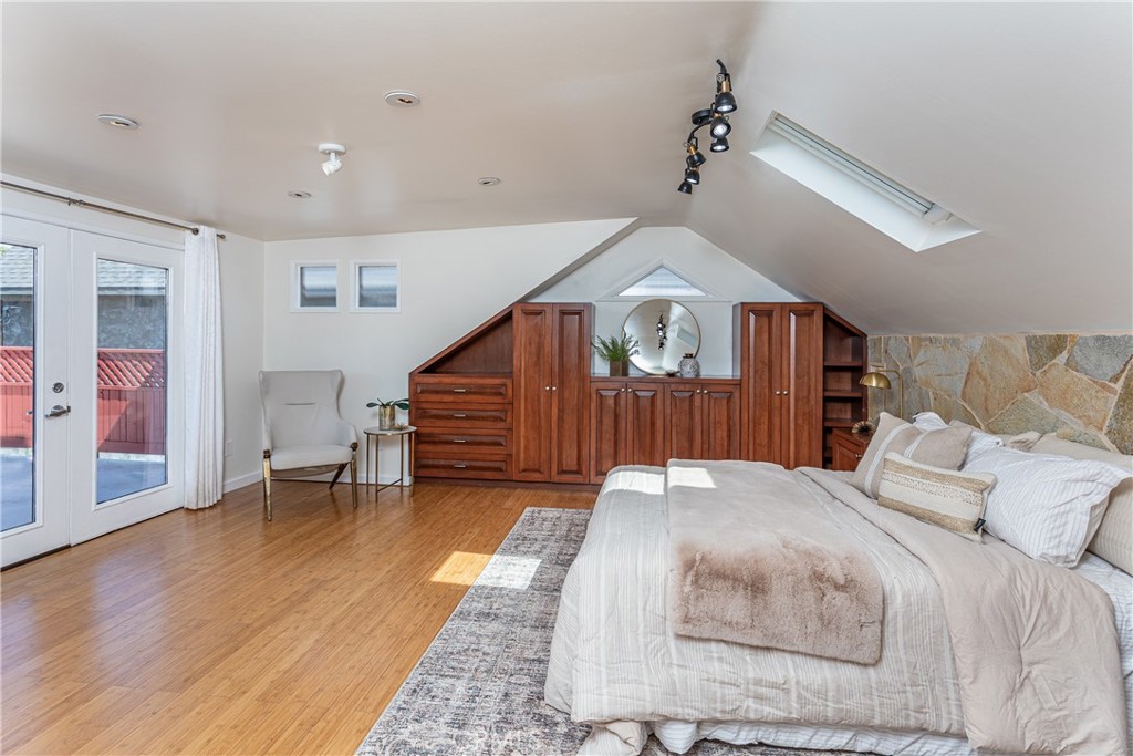 Spacious Bedroom with Skylight and Built-In Wardrobe in Homes for Sale