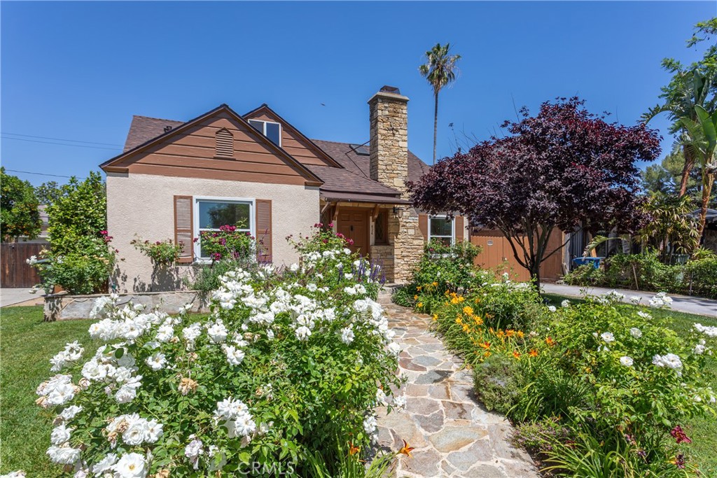 Charming Home with Lush Garden and Stone Pathway for Real Estate Listings