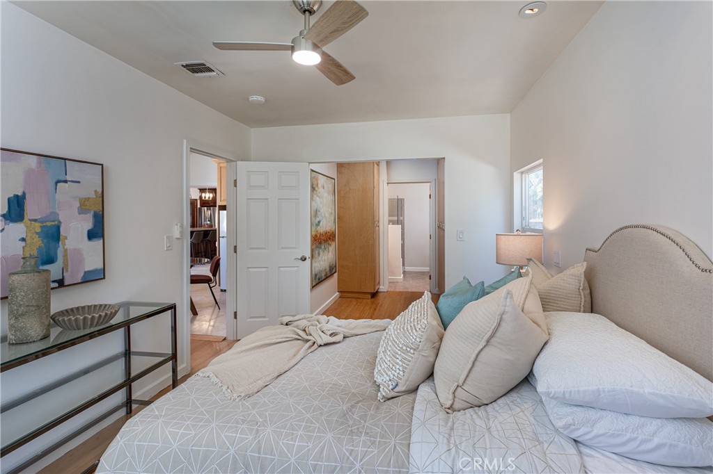 Spacious Bedroom in a Modern Home with Stylish Decor and Ceiling Fan