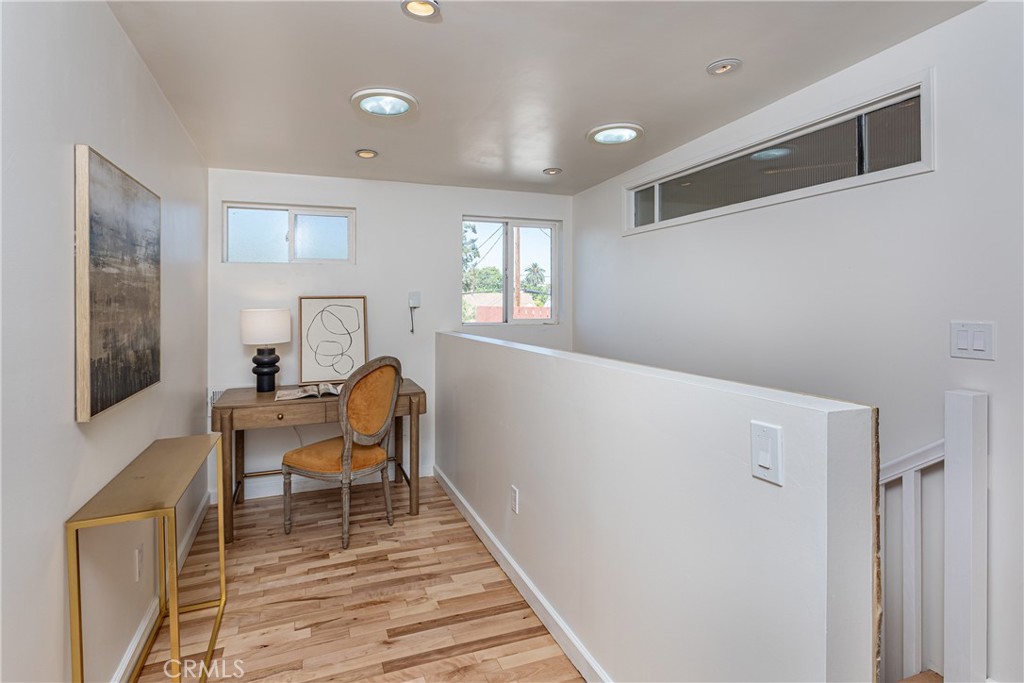 Hallway Office Nook with Wooden Floors and Artwork, Real Estate Listings