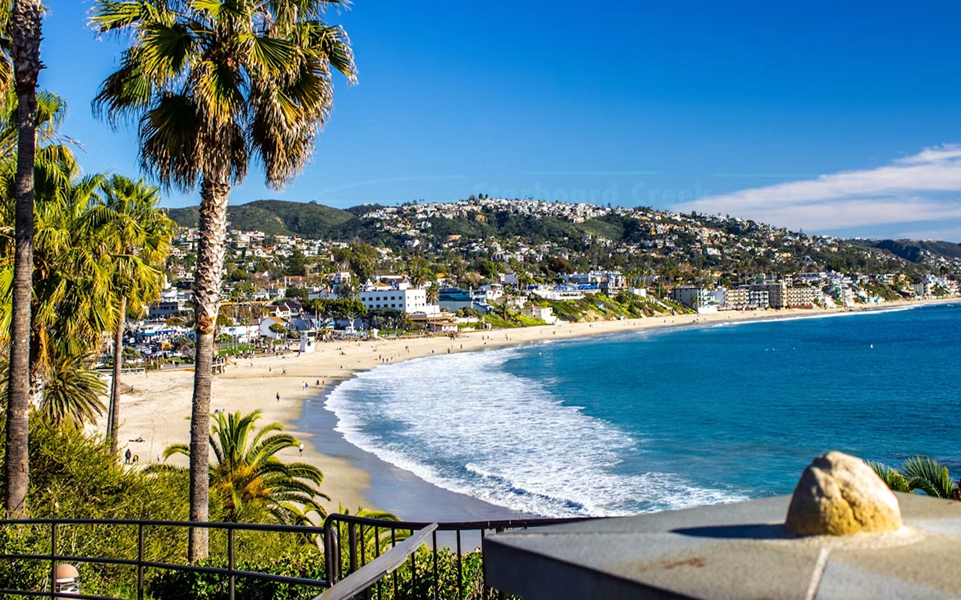 Scenic View of Laguna Beach Coastal Homes and Blue Ocean Waves