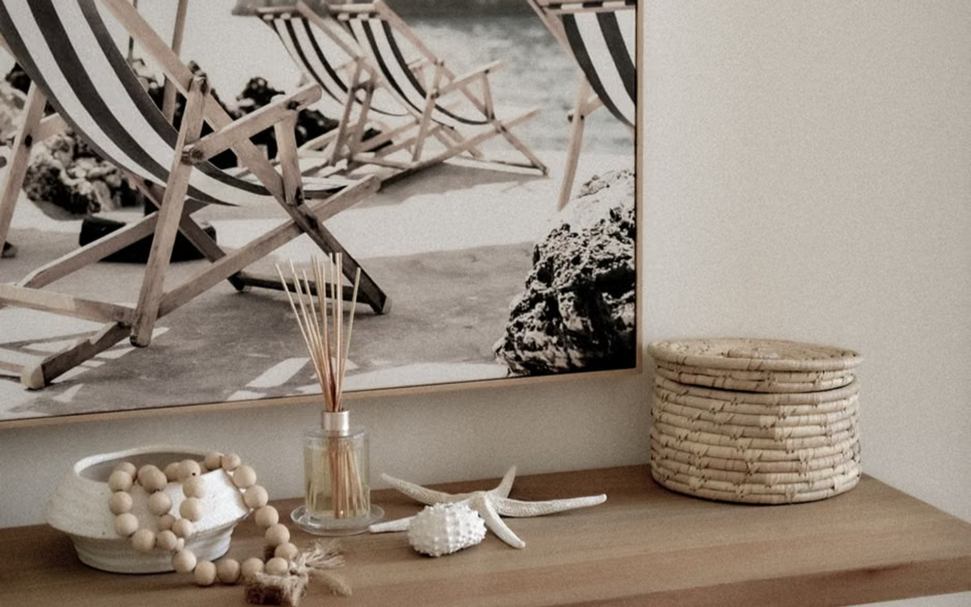 Beach-Themed Decor with Seashells and Wooden Bowls on a Table